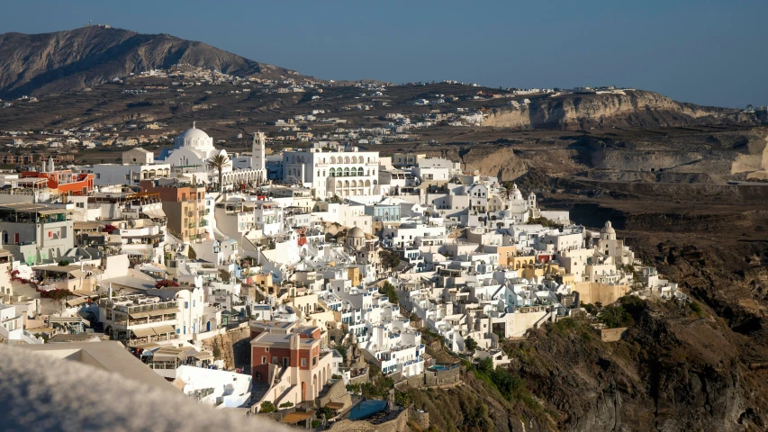 a very tall building sitting on the side of a cliff