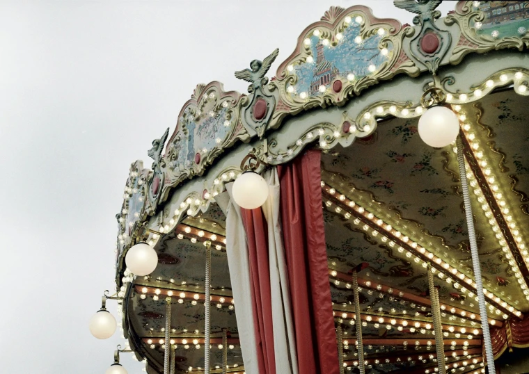 a vintage merry go round, complete with many lights