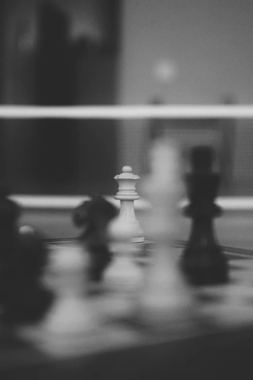 a blurry image of people playing chess