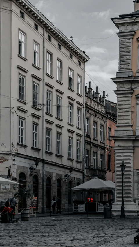 the buildings next to each other on a cobble stone street