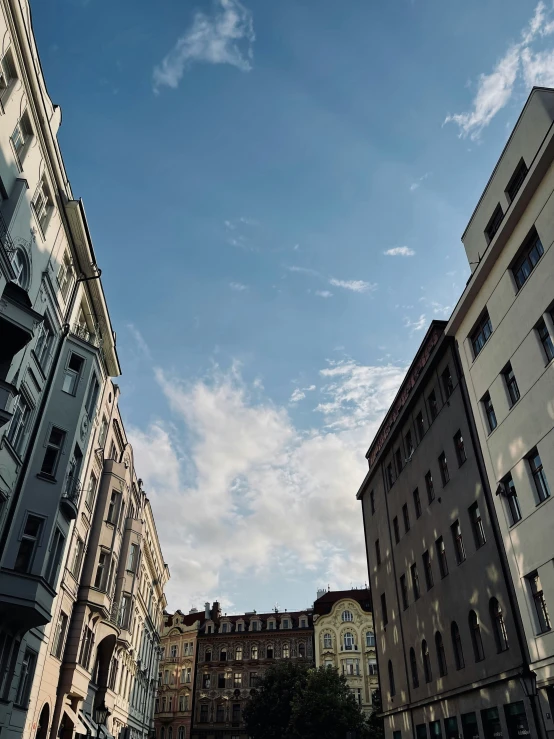 some buildings and some blue sky with clouds