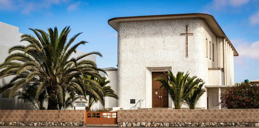 an old church with a brown door on the side