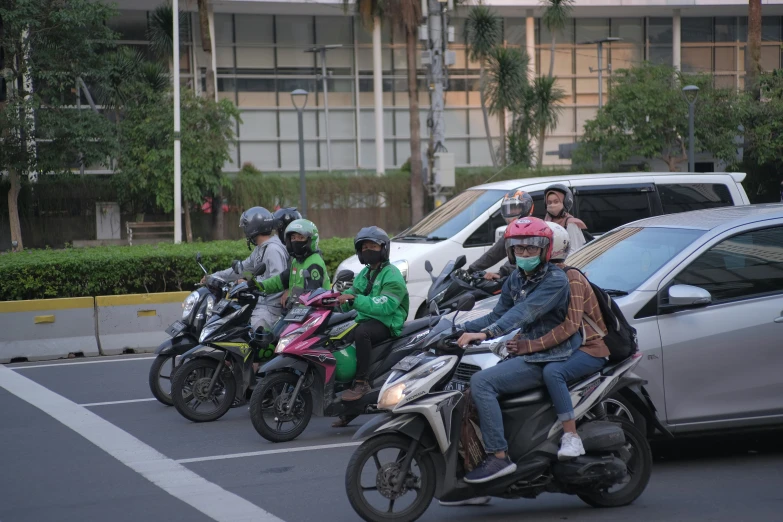 the motorcyclists are in formation on their bikes