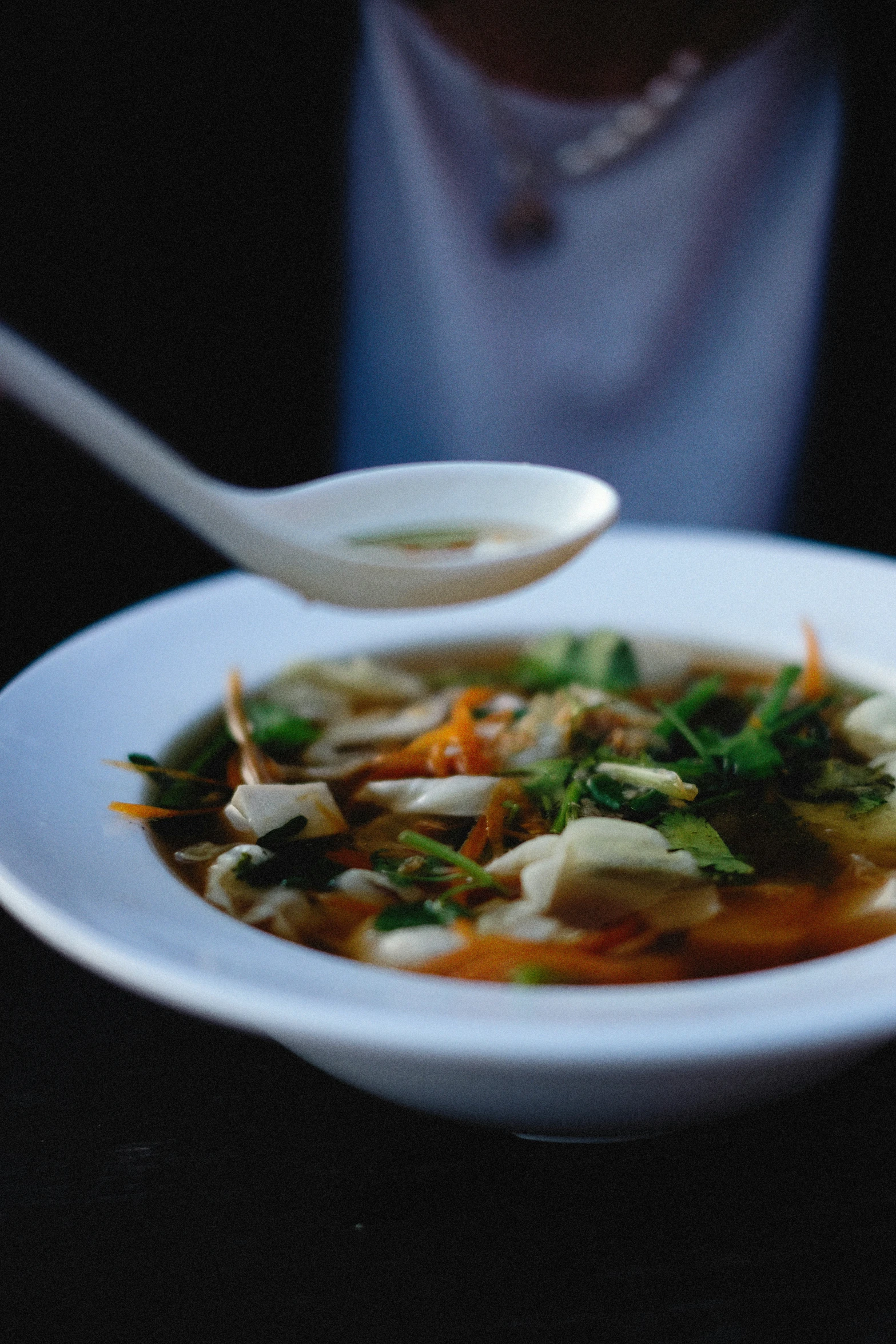 a bowl of soup with a spoon on it