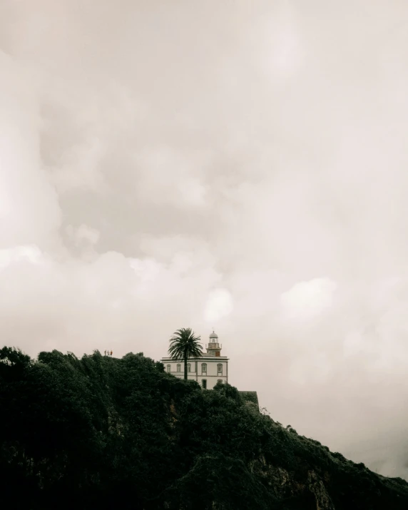 an island with a lighthouse on top