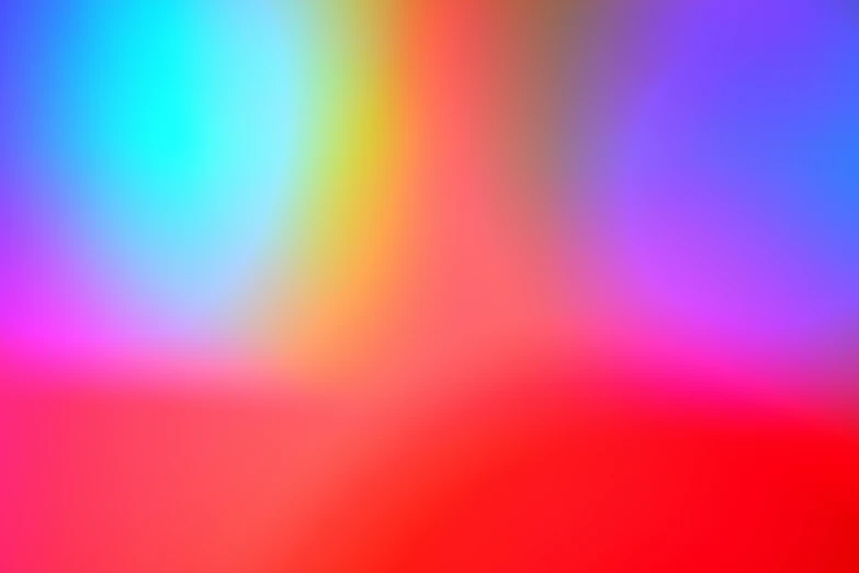 a blurry, blurred image of a red yellow and blue