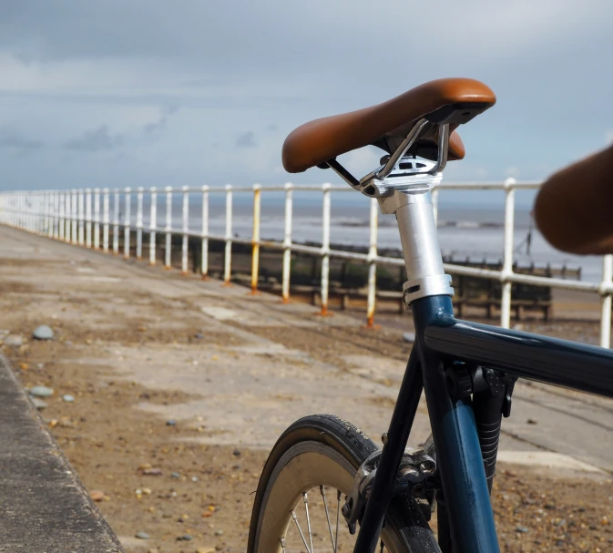 there is a bicycle that is by the beach