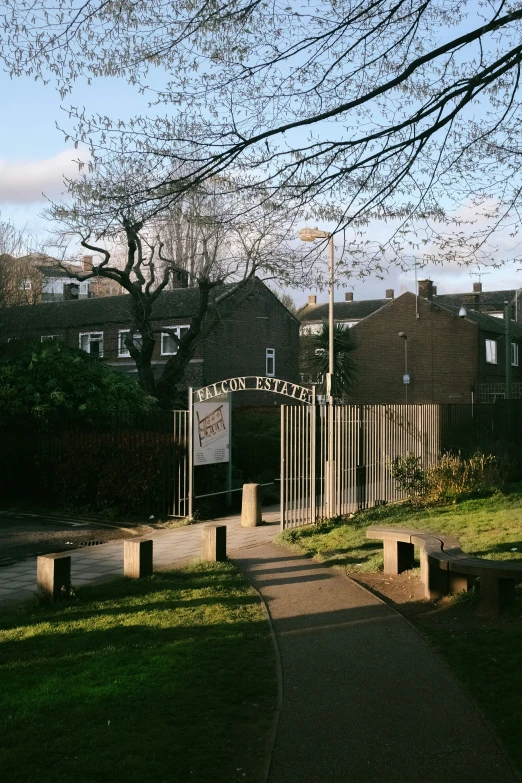 a park bench in front of a sign