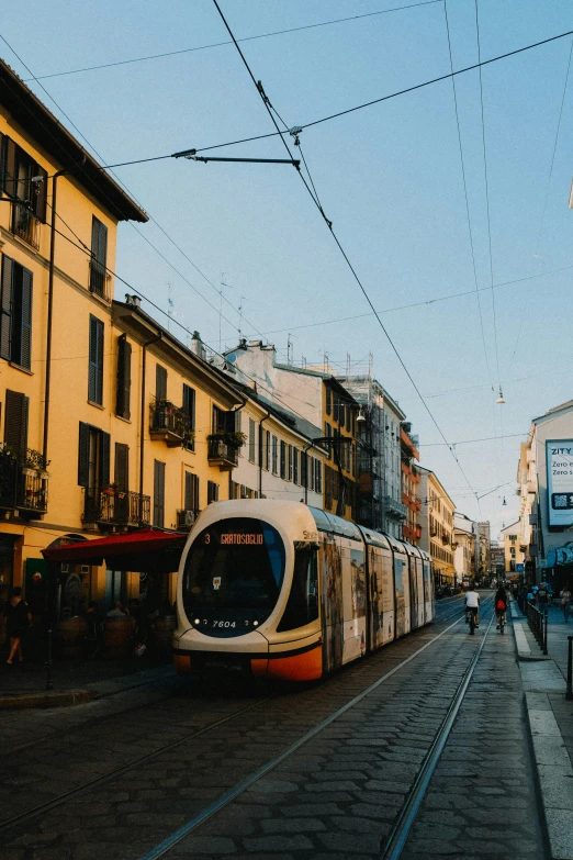 a street with an electric train stopped on it