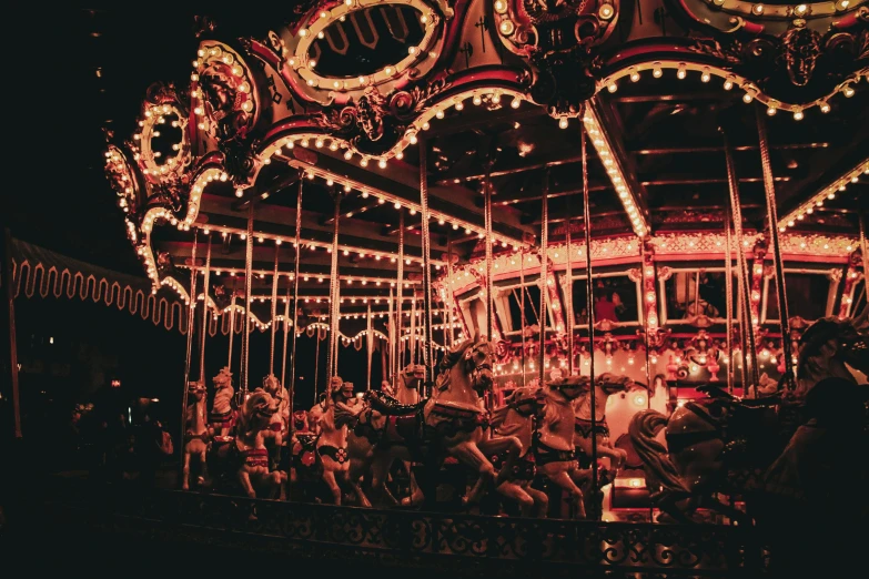 a merry go round at night with many lights