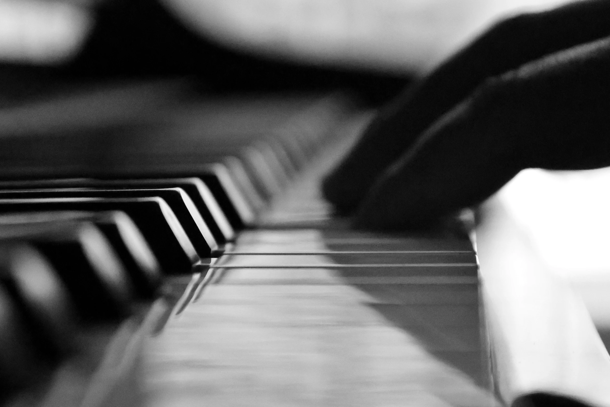 a close - up of a piano keyboard in black and white