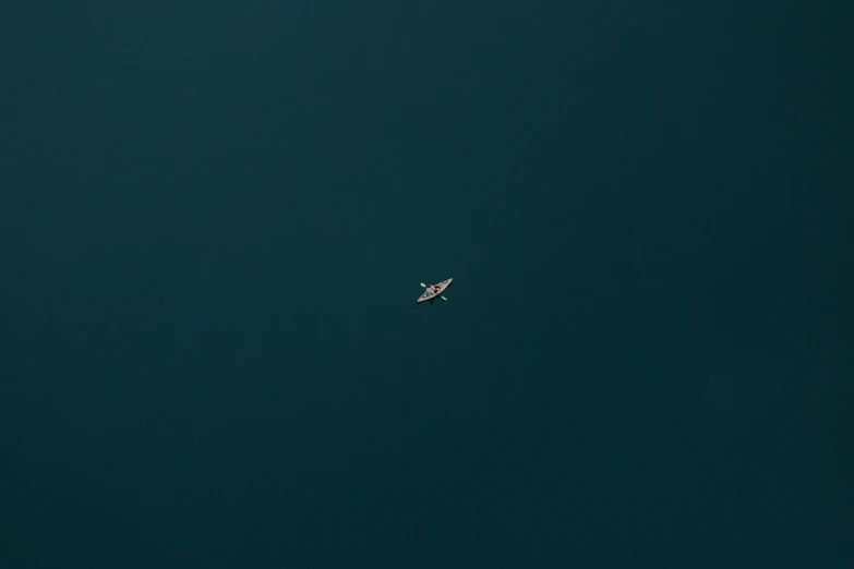 a airplane flies through the dark green sky