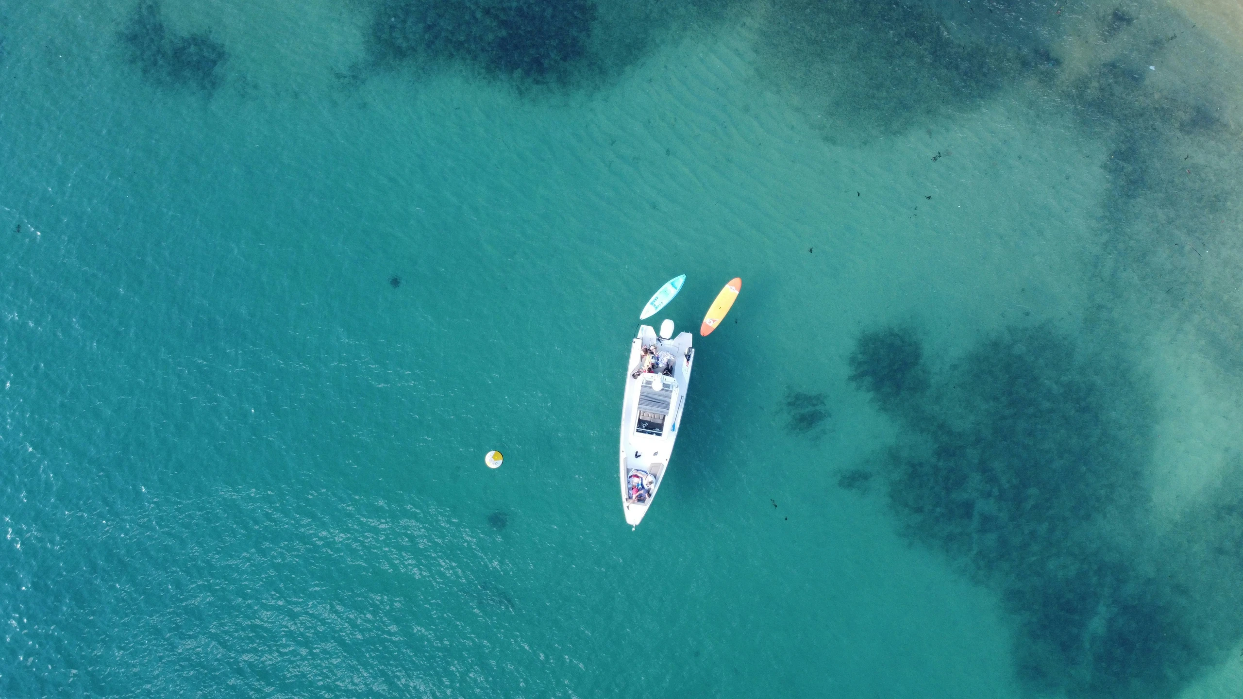 a long boat sailing across the sea