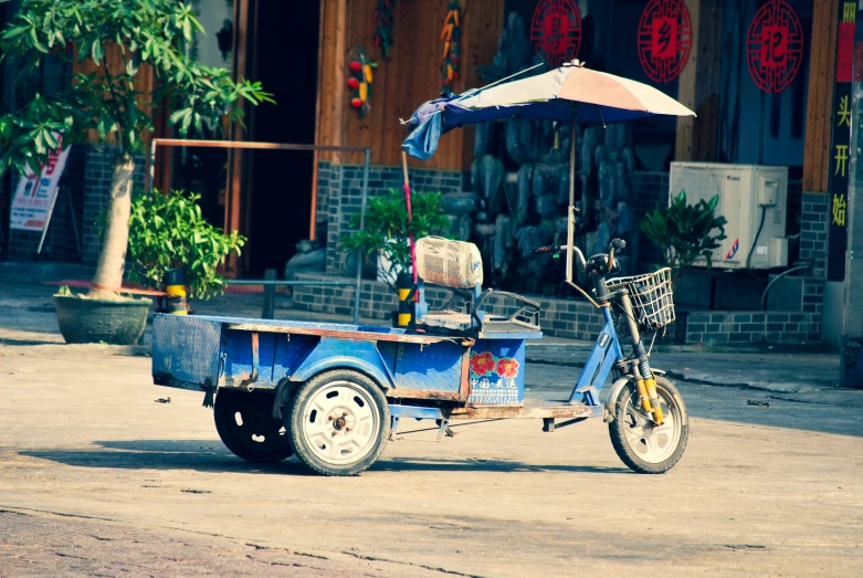 a bicycle with trailer parked on the road