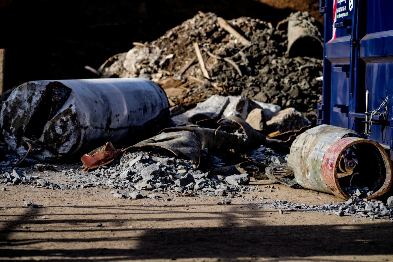 an old and rusty gas can laying on the ground