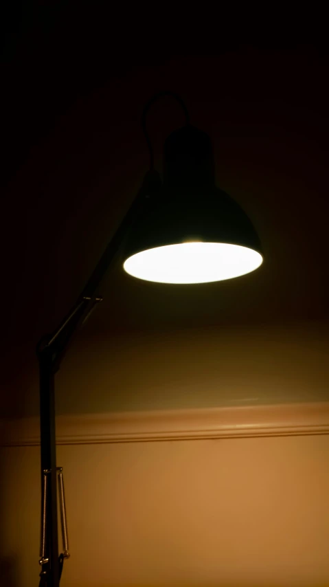 a lamp sitting next to a window in a room