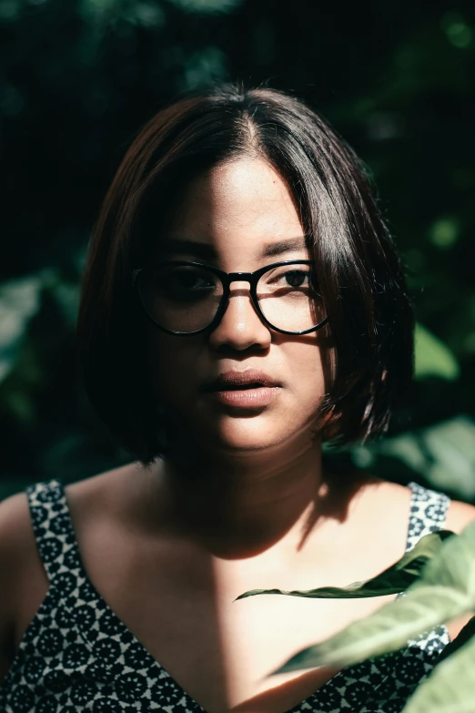 the woman is wearing glasses and a tie