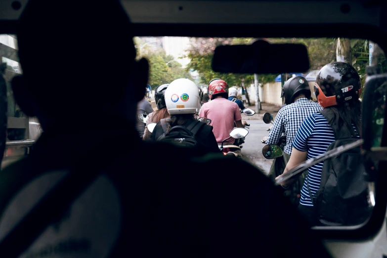 a group of people riding on the back of a bus