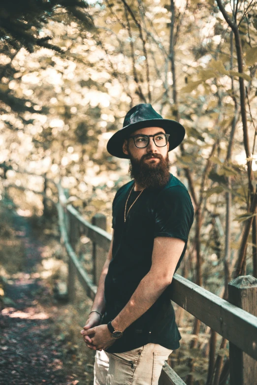 a man that is standing on the bridge