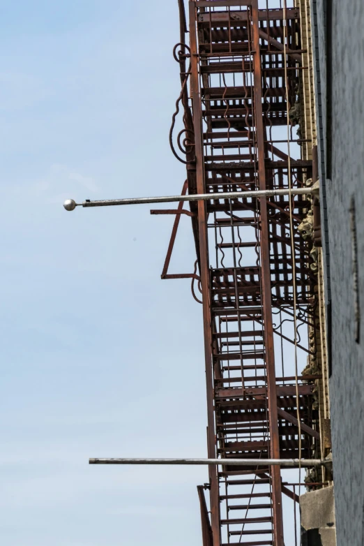 an electrical pole on top of a building and a light