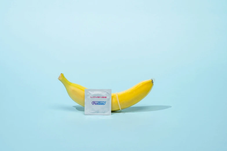 a single packet of gum next to a banana