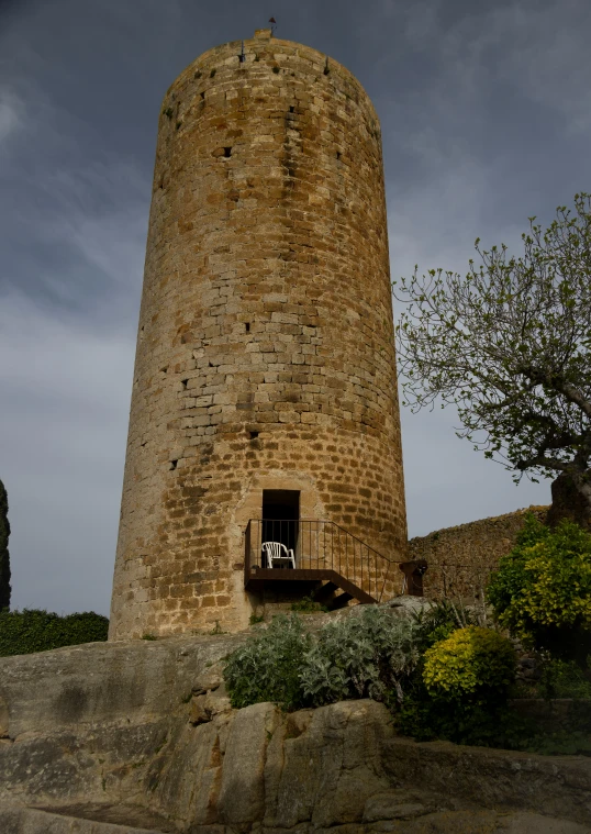 the tall stone tower has a door