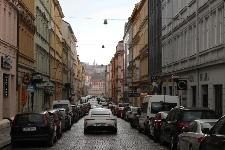 a street lined with parked cars on both sides