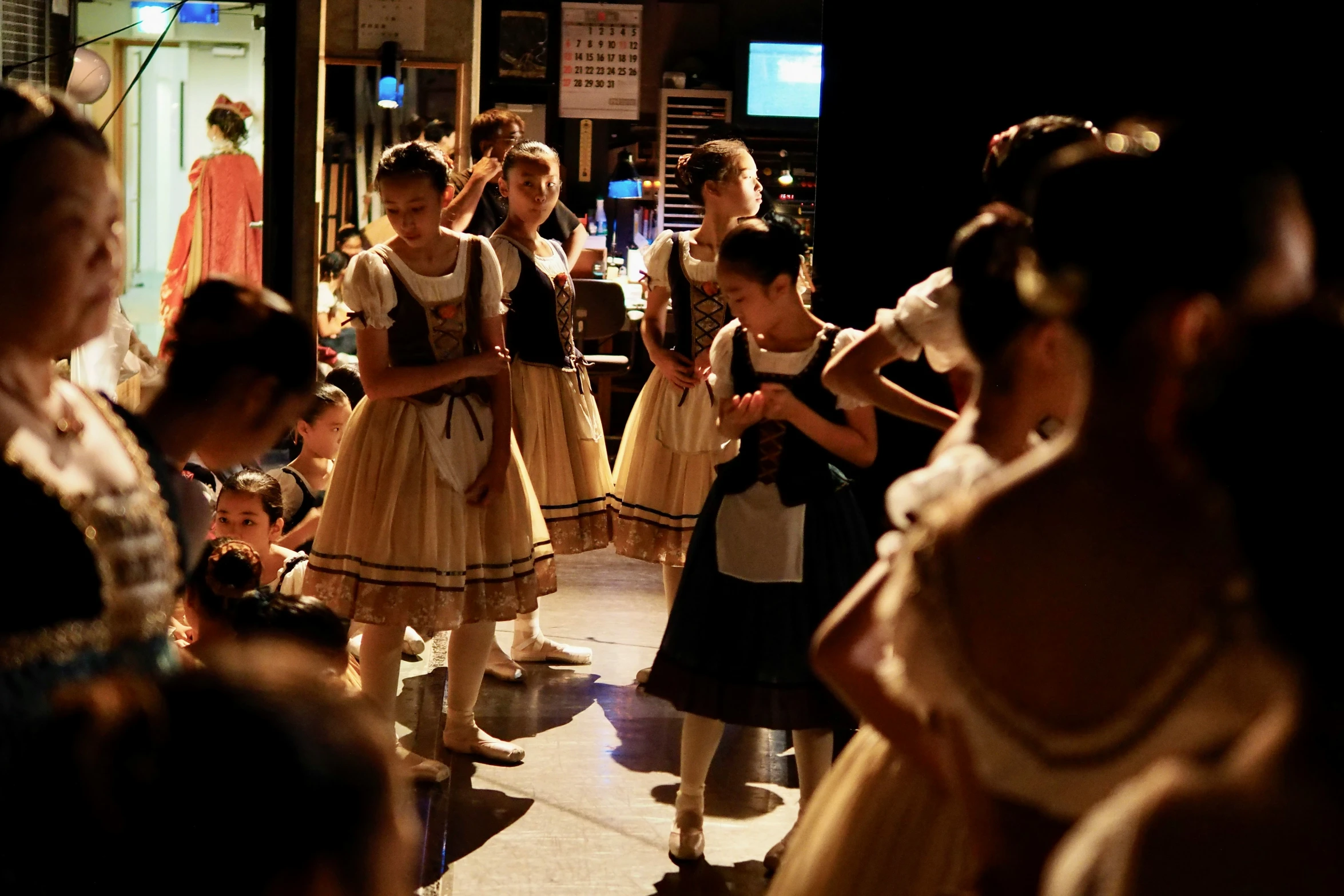 several children dressed up and waiting in line