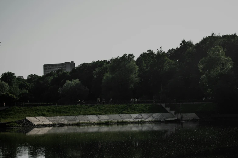 some steps out across the water from some trees