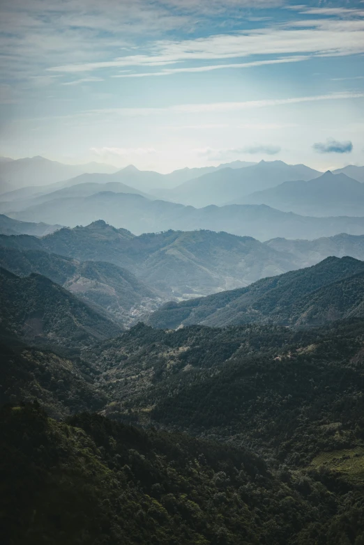 an aerial view shows the vast green mountains