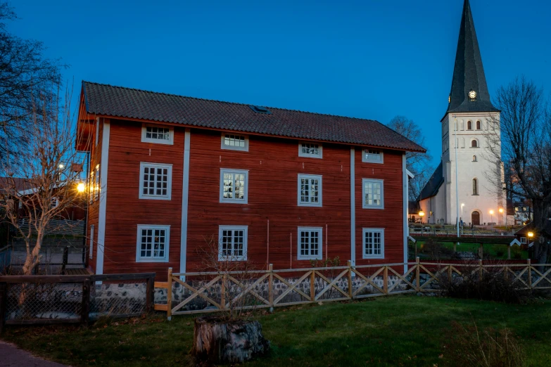 there is a building with windows and a clock tower