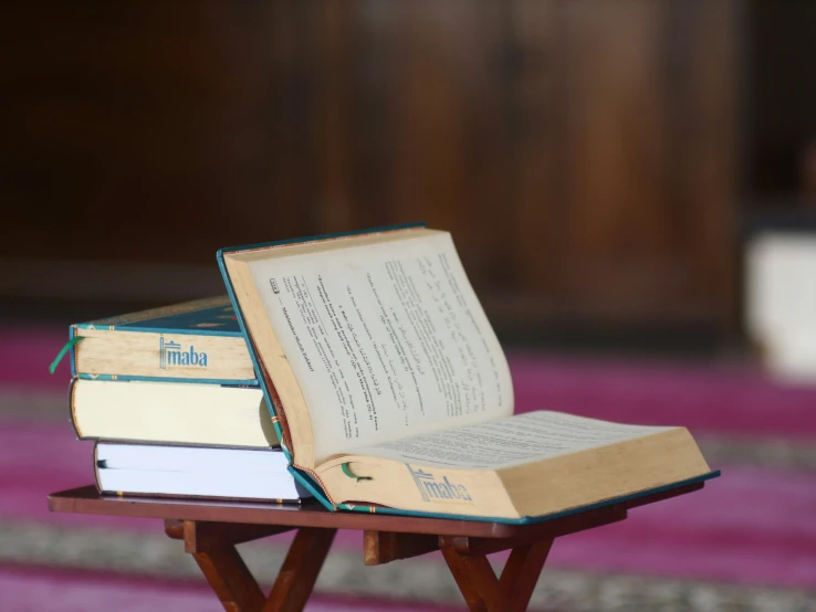 a book is open and on a small table