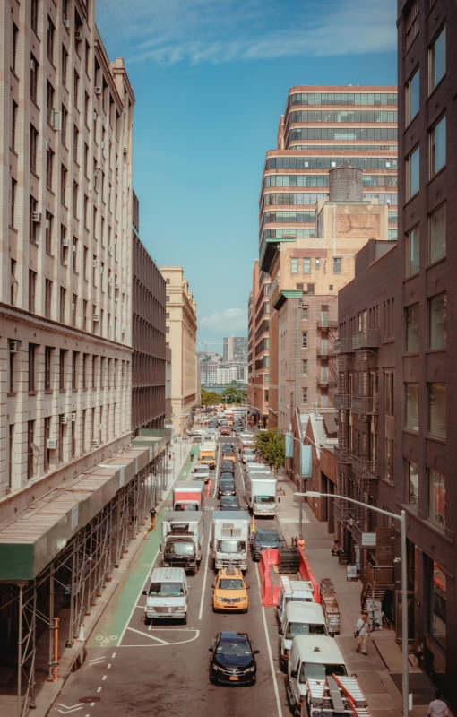 a busy street with several buildings in the background