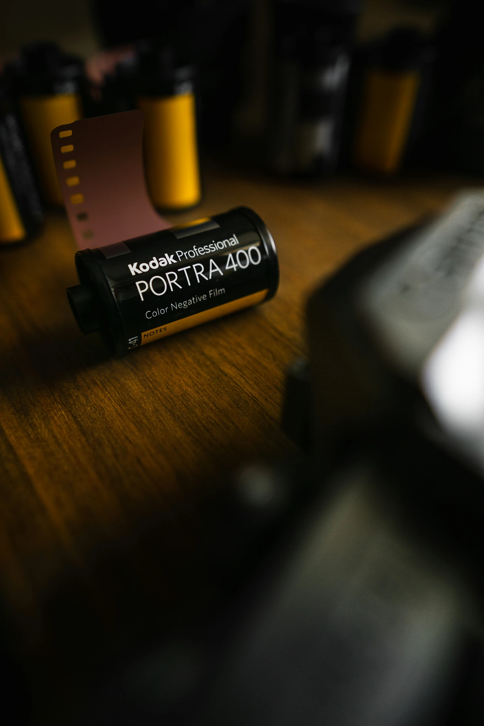 a couple of batteries sitting on top of a wooden table