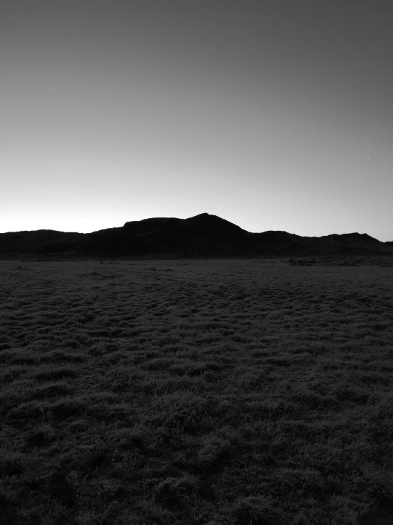 a mountain in the distance with no one standing