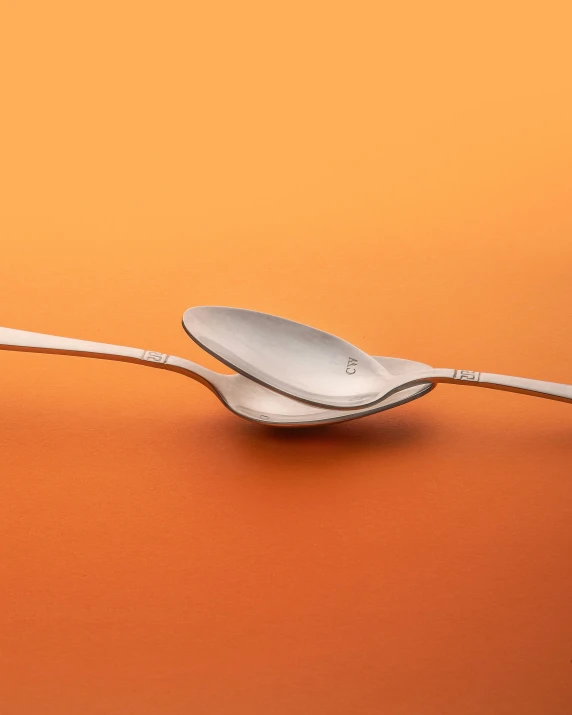 two spoons in one of the two sides of a spoon