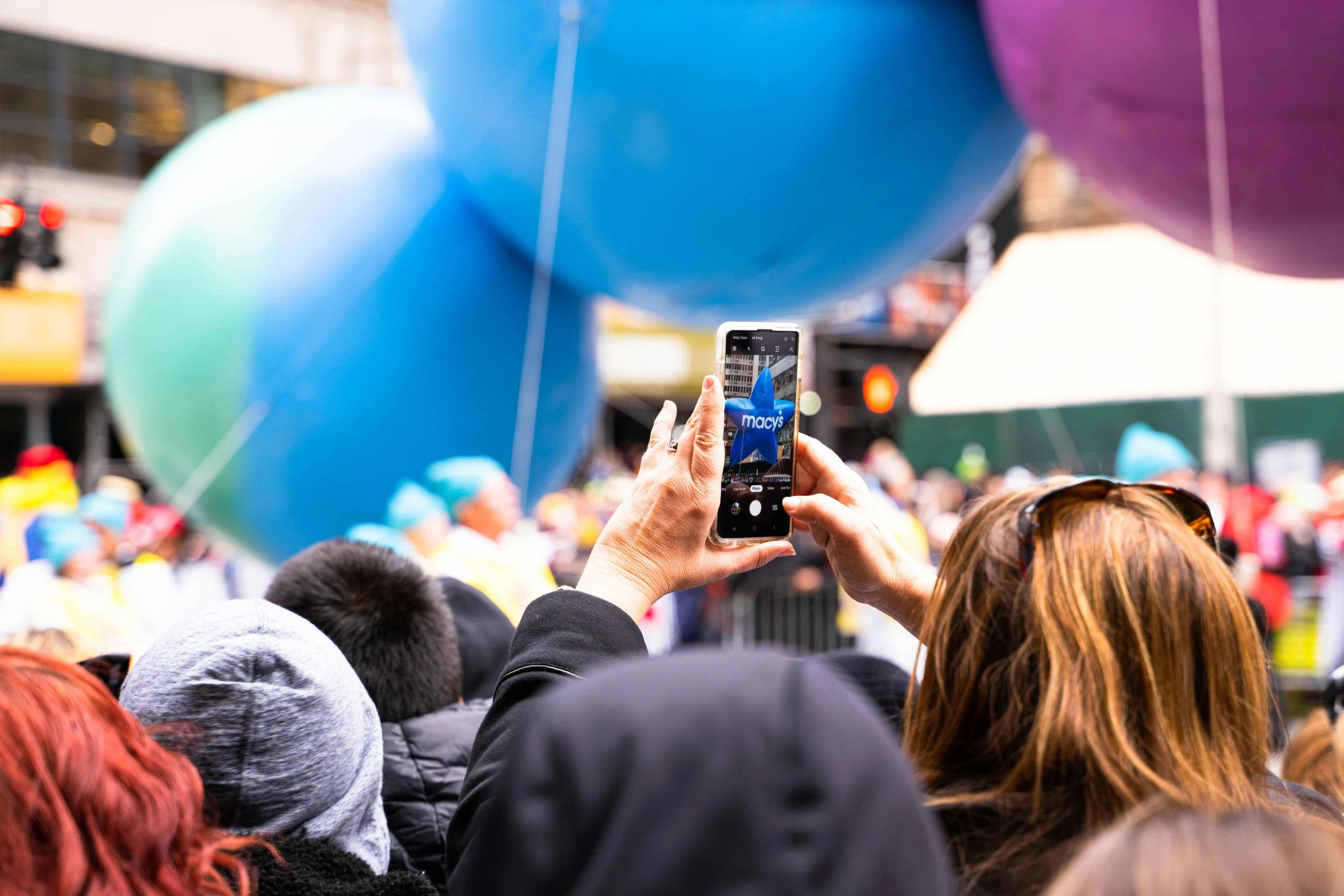 a person is taking a picture in front of balloons