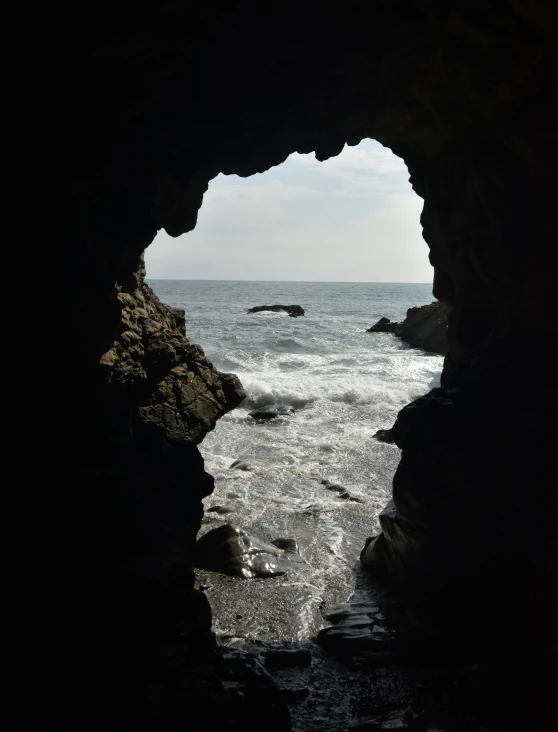 looking out from an open cave on the beach