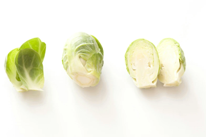 the cabbages are half - peeled and half sliced