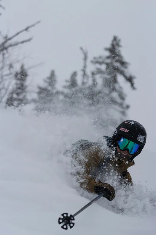 a skier makes a turn through the snow