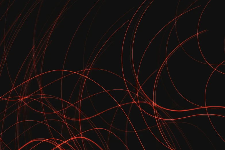 an abstract pattern in red and black, with light streaks on the back of it