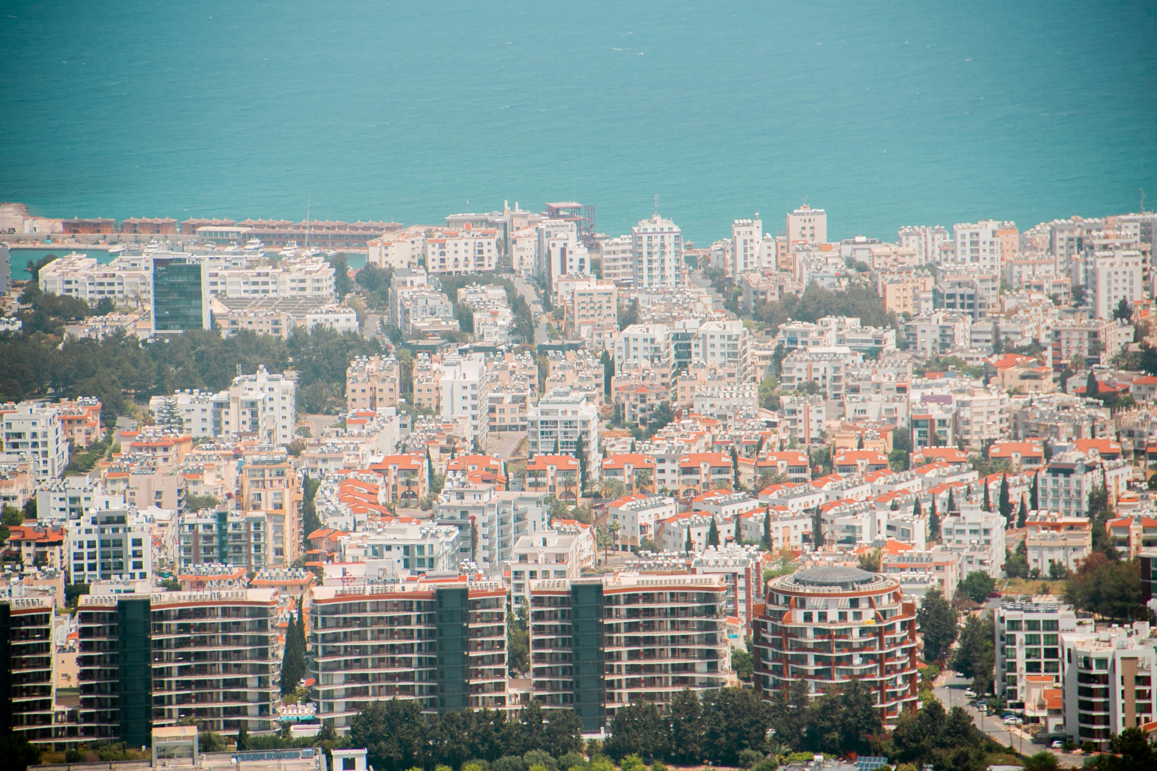 the city is seen from above it with many buildings and trees