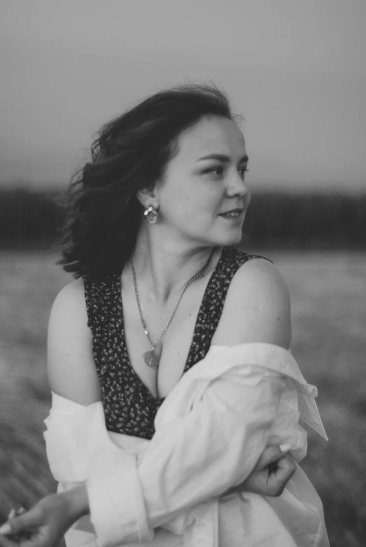 black and white image of a woman with shoulder length sleeves open