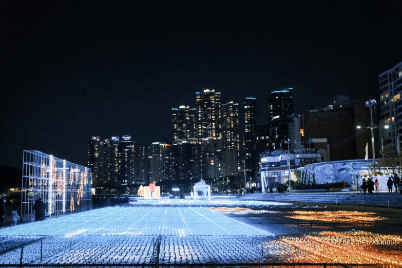 the lights of the city on the buildings at night