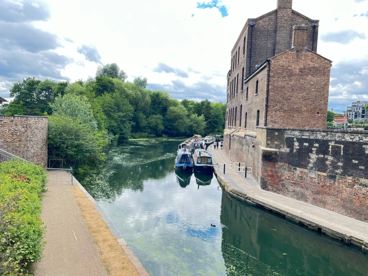 the boaters are moving along the waterway in the city