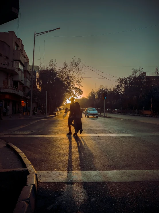 a person walking down the road with an umbrella