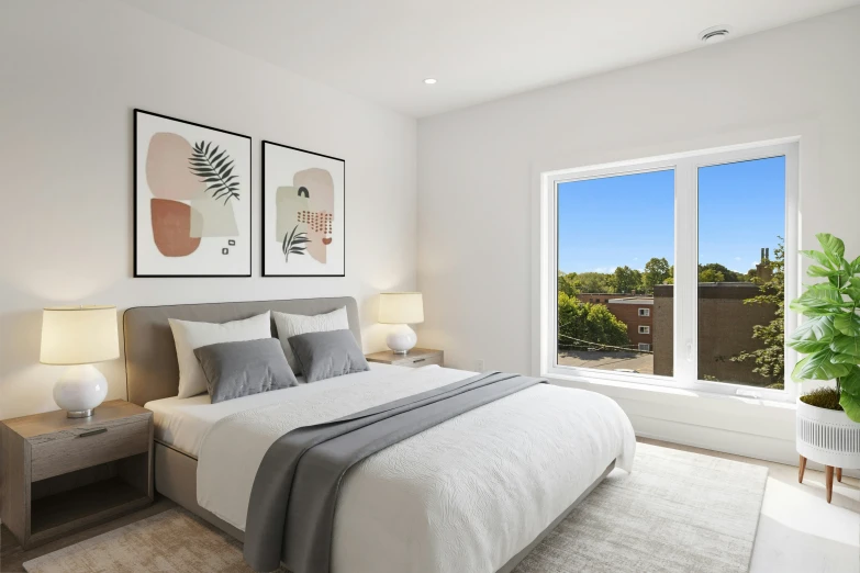 a white bed sits in front of a large window