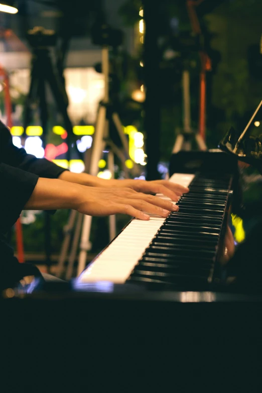 a person playing piano in a city area