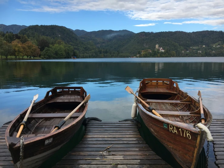 there are two empty boats on the dock