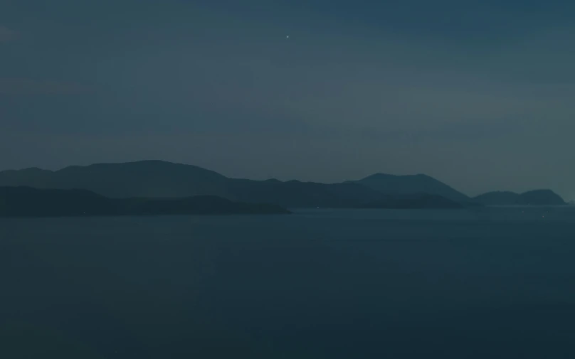 a boat out at sea on a stormy night